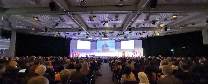 A group of people sitting in chairs in a room AI-generated content may be incorrect.